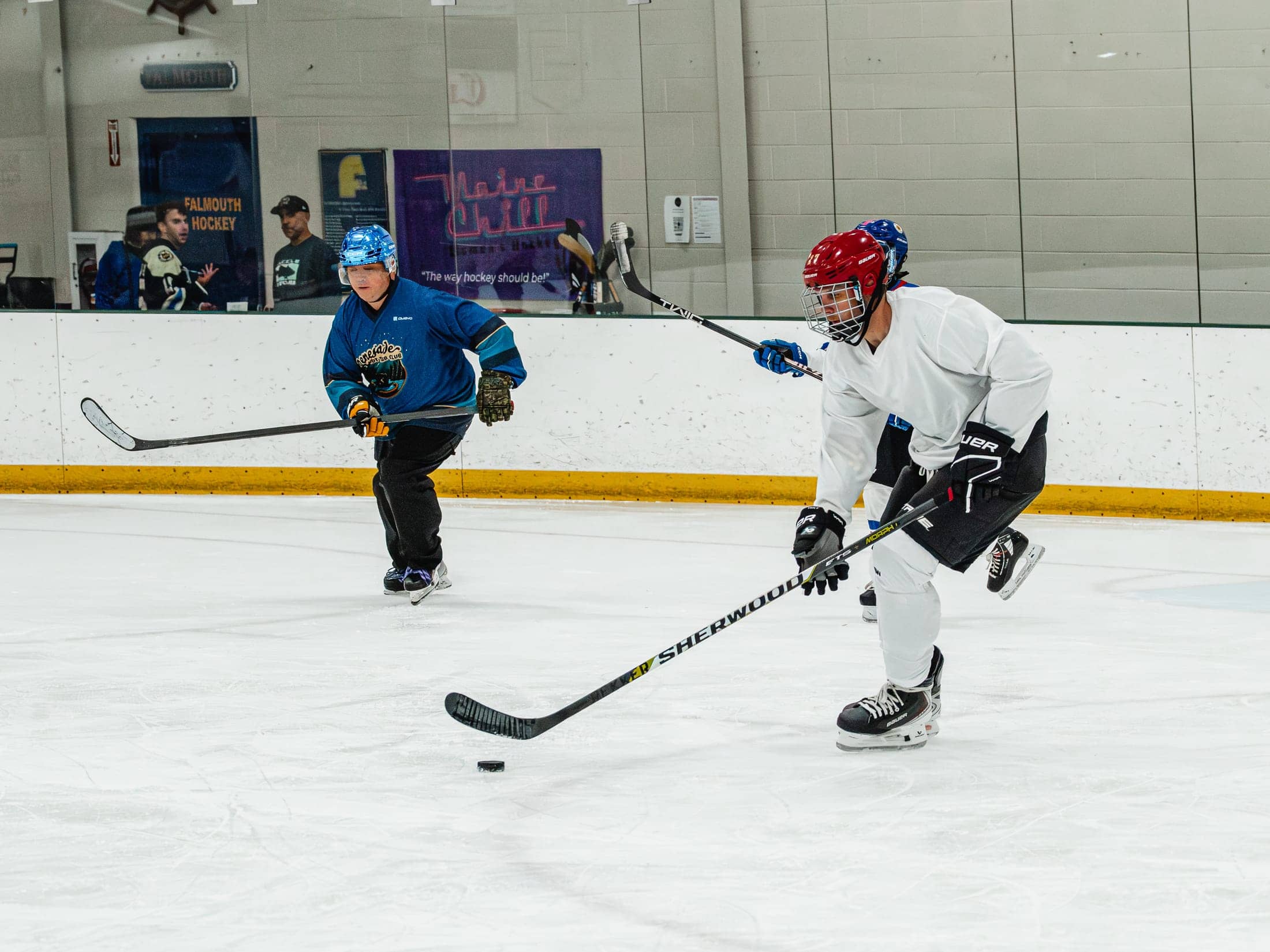 Players on the ice at the Maine Chill Pride Cup