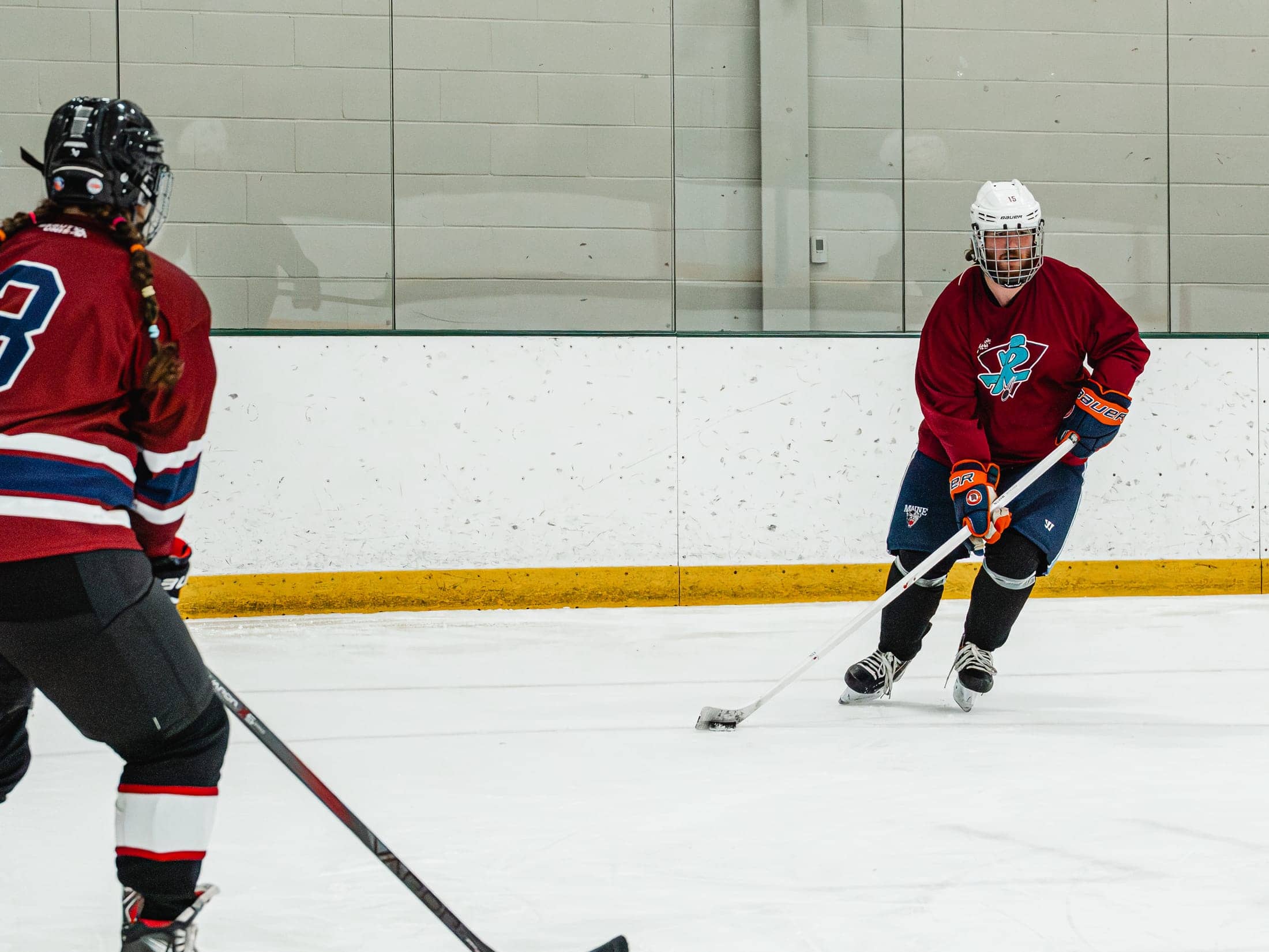 Players on the ice at the Maine Chill Pride Cup