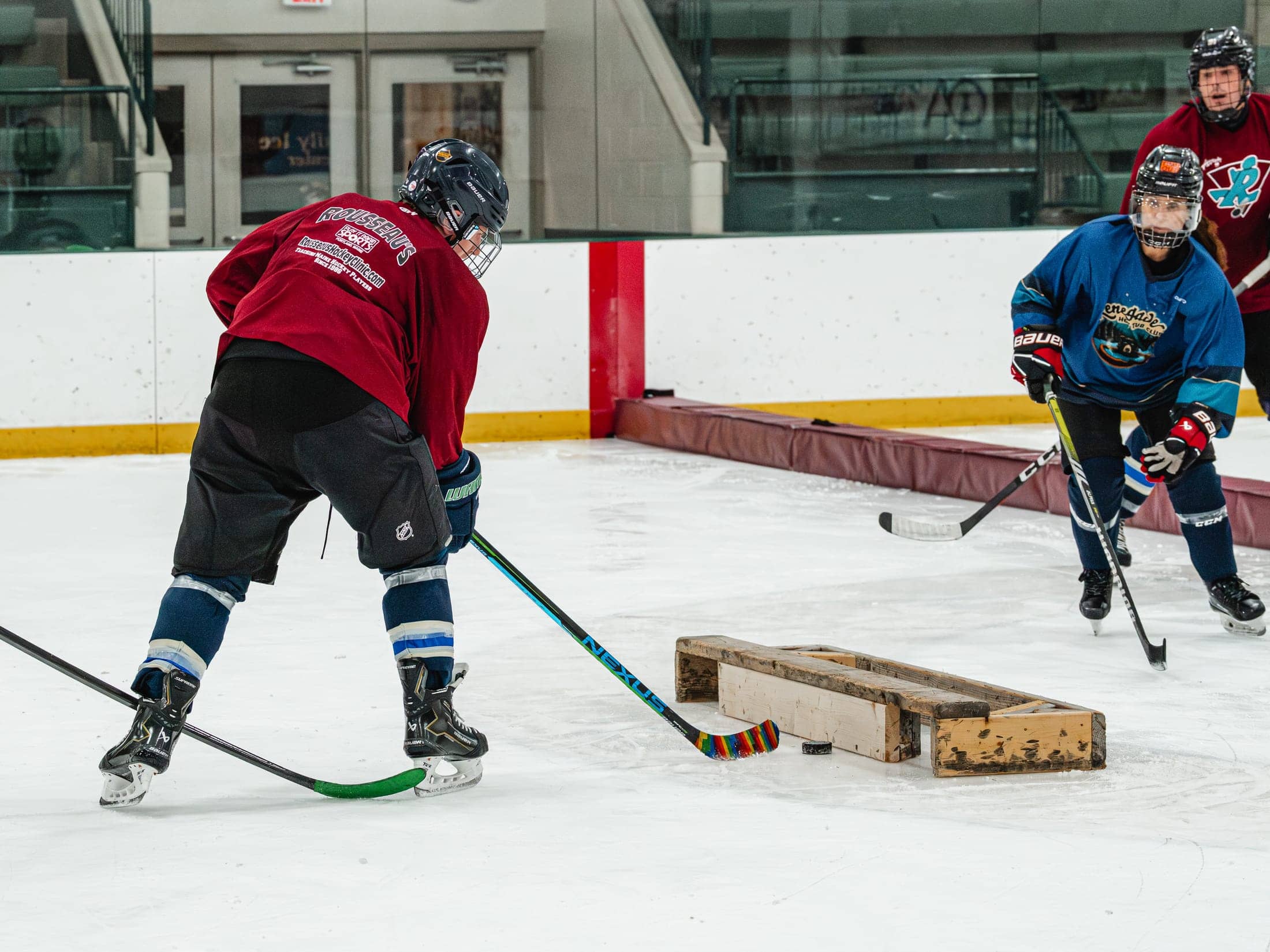 Players on the ice at the Maine Chill Pride Cup