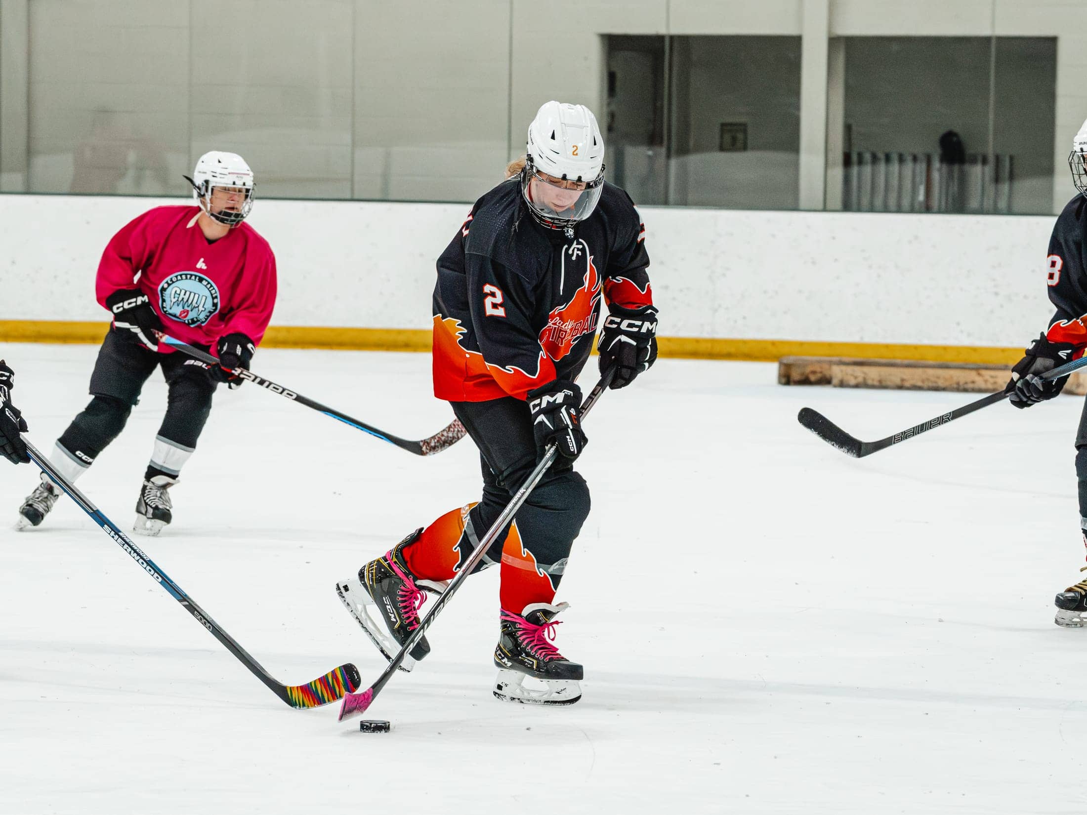 Players on the ice at the Maine Chill Pride Cup