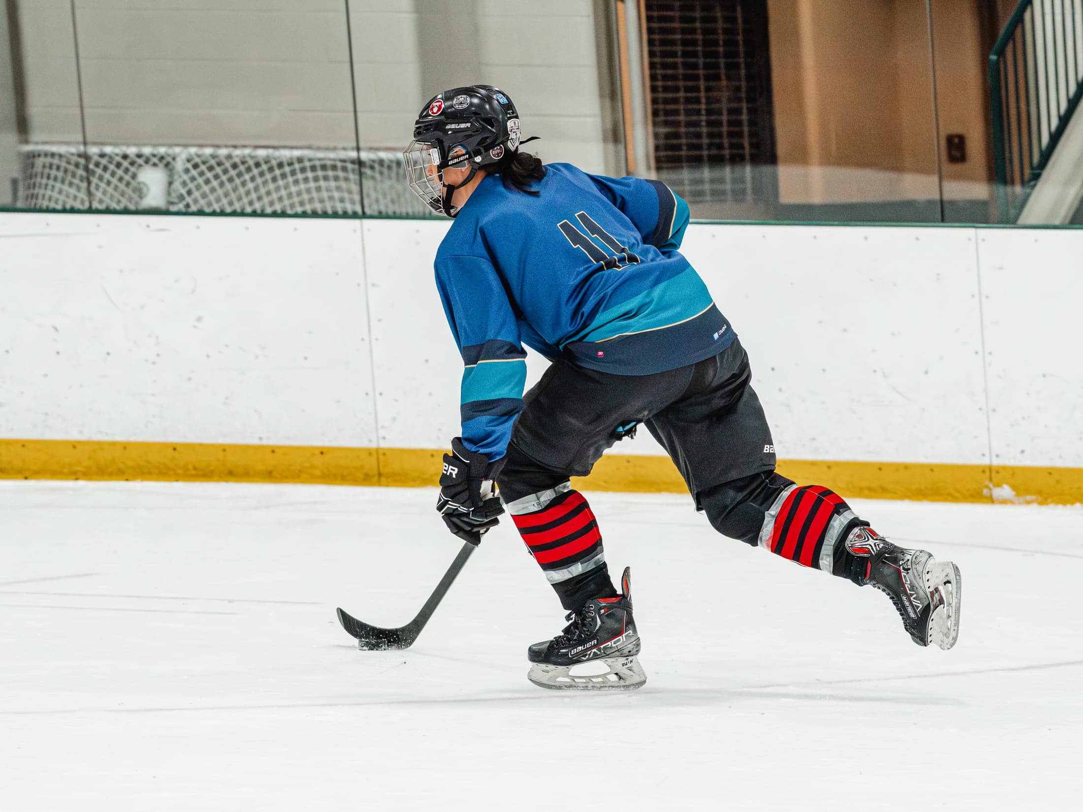 Players on the ice at the Maine Chill Pride Cup