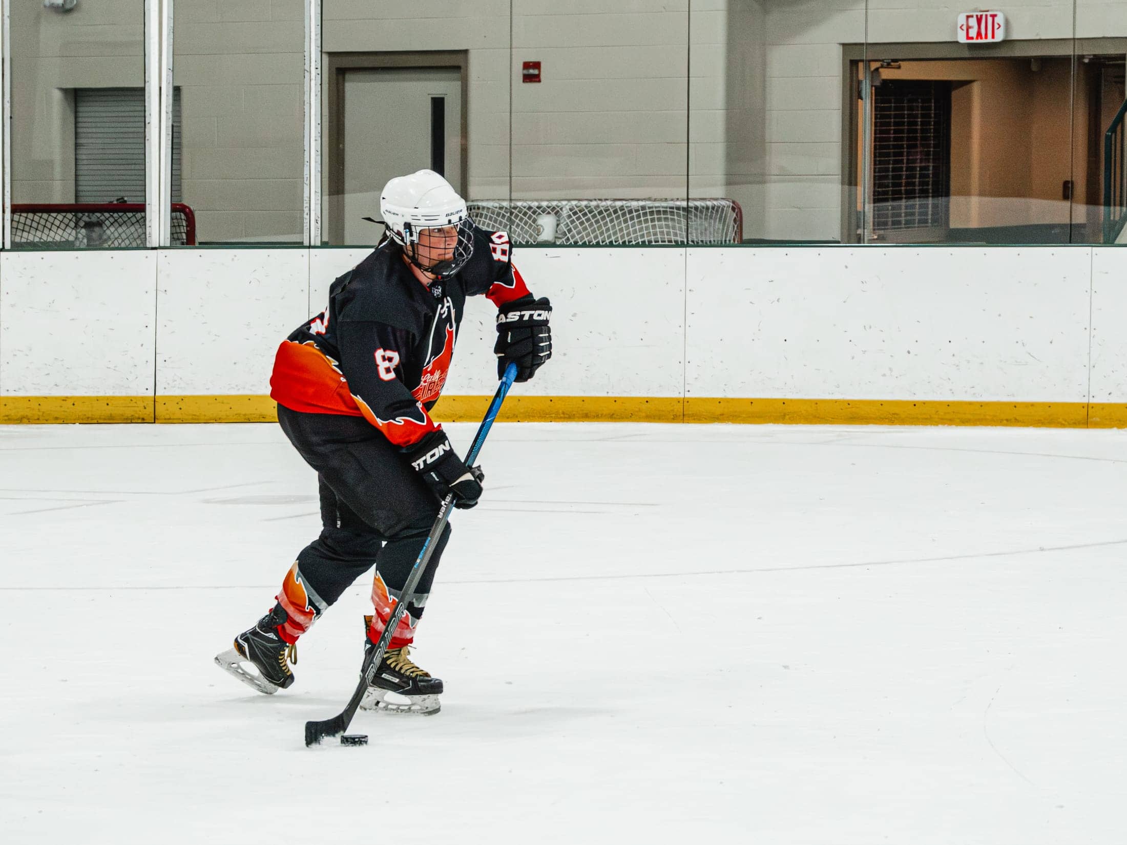 Players on the ice at the Maine Chill Pride Cup