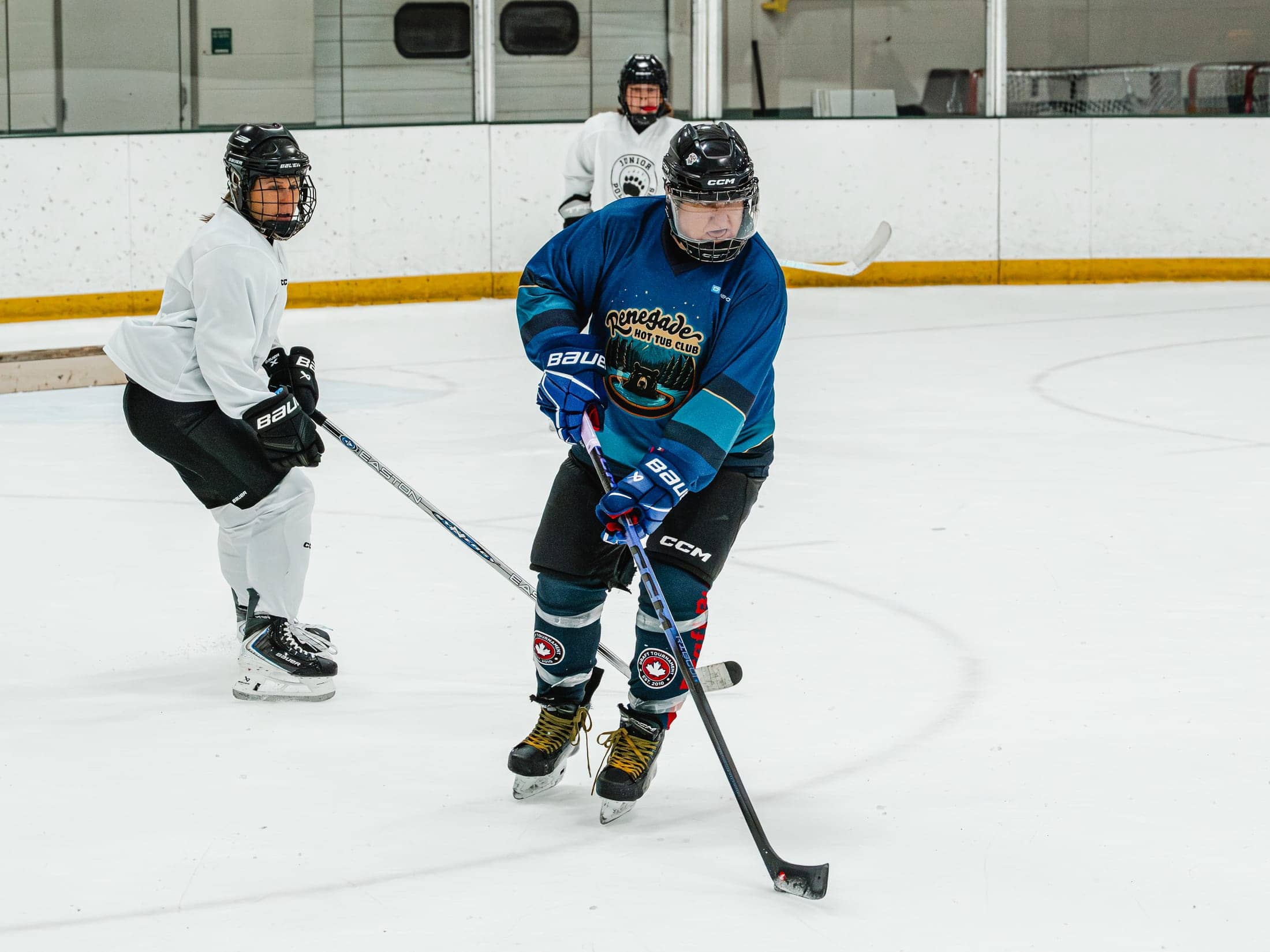 Players on the ice at the Maine Chill Pride Cup