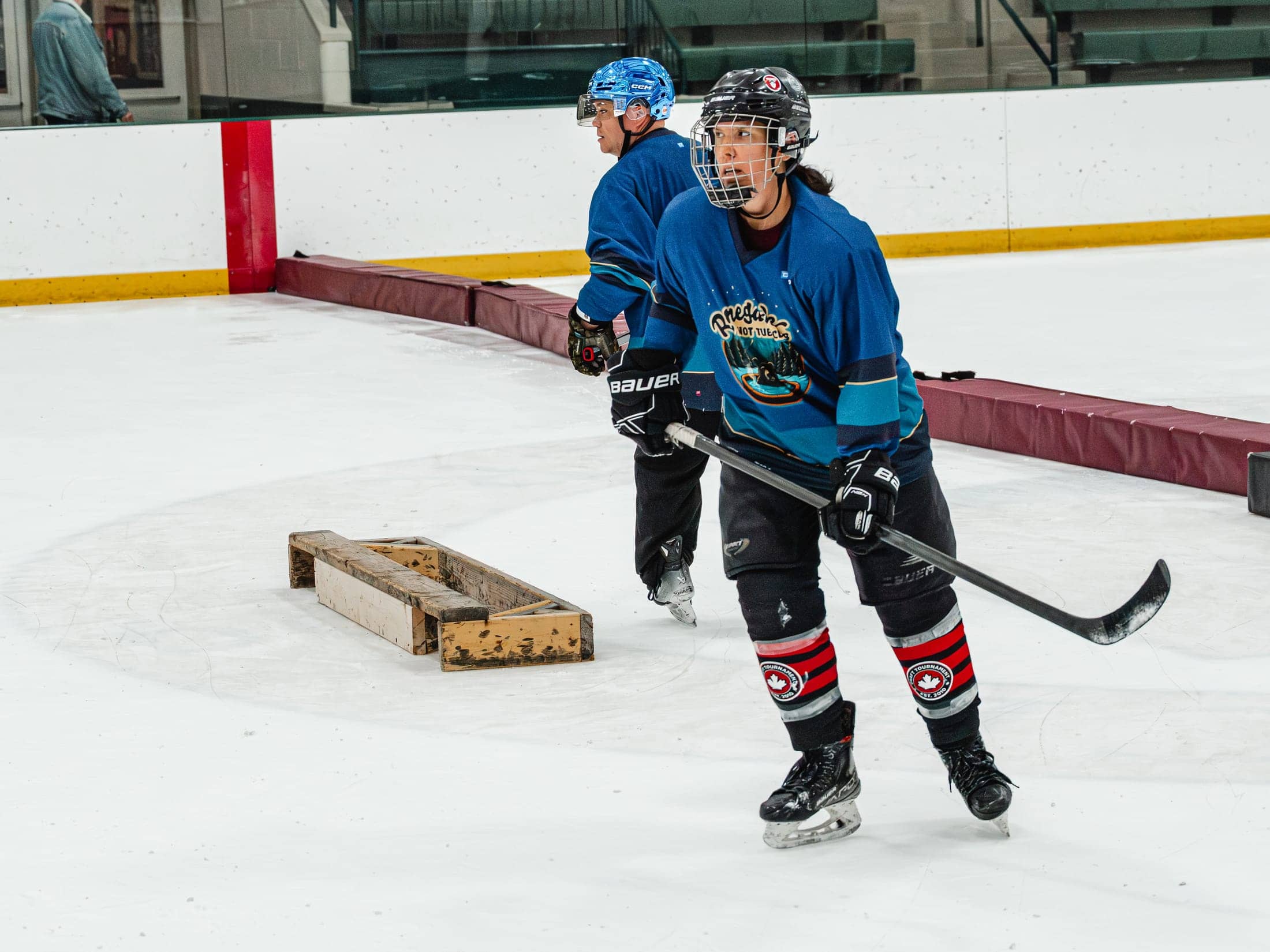 Players on the ice at the Maine Chill Pride Cup