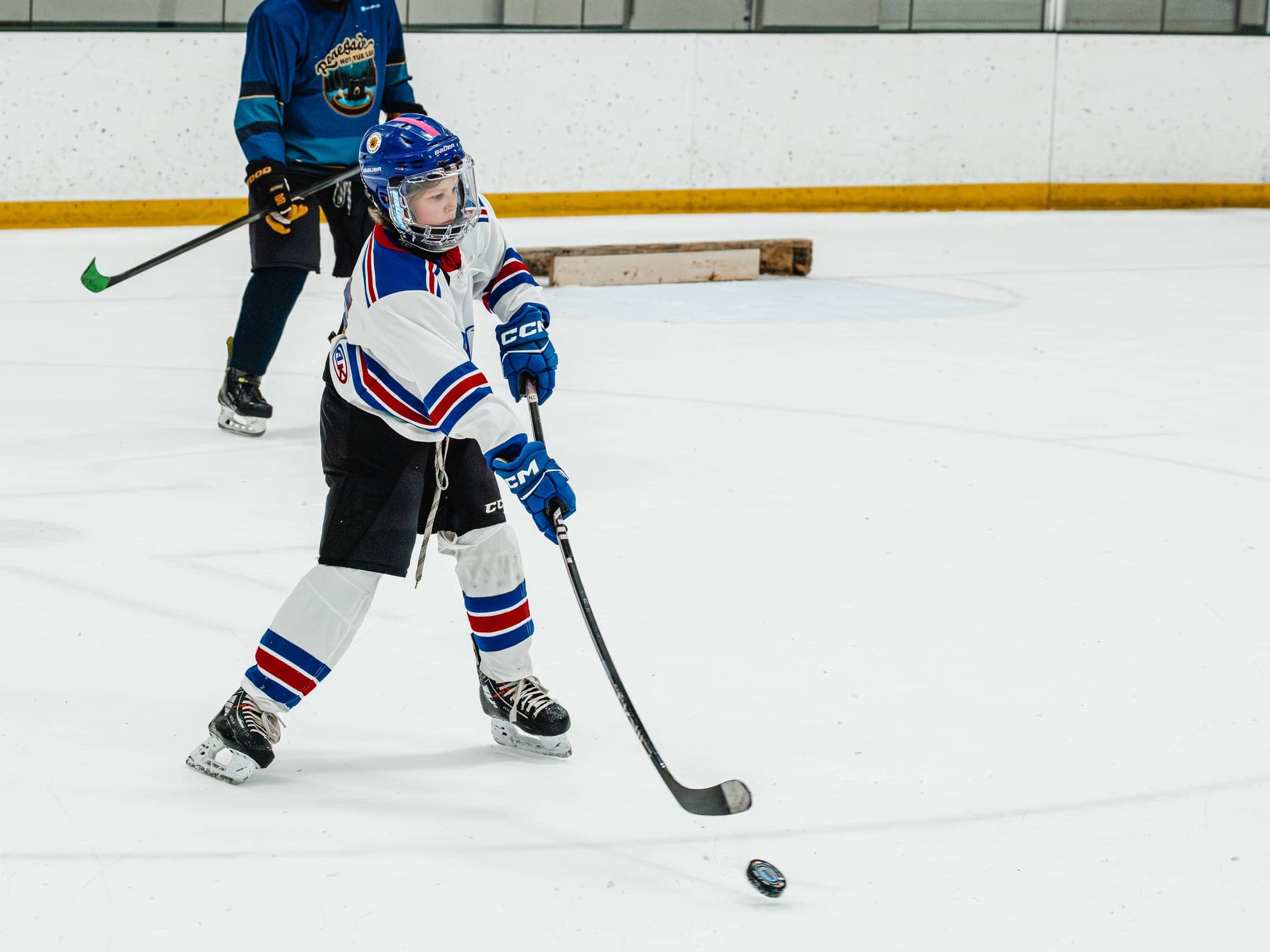 Players on the ice at the Maine Chill Pride Cup