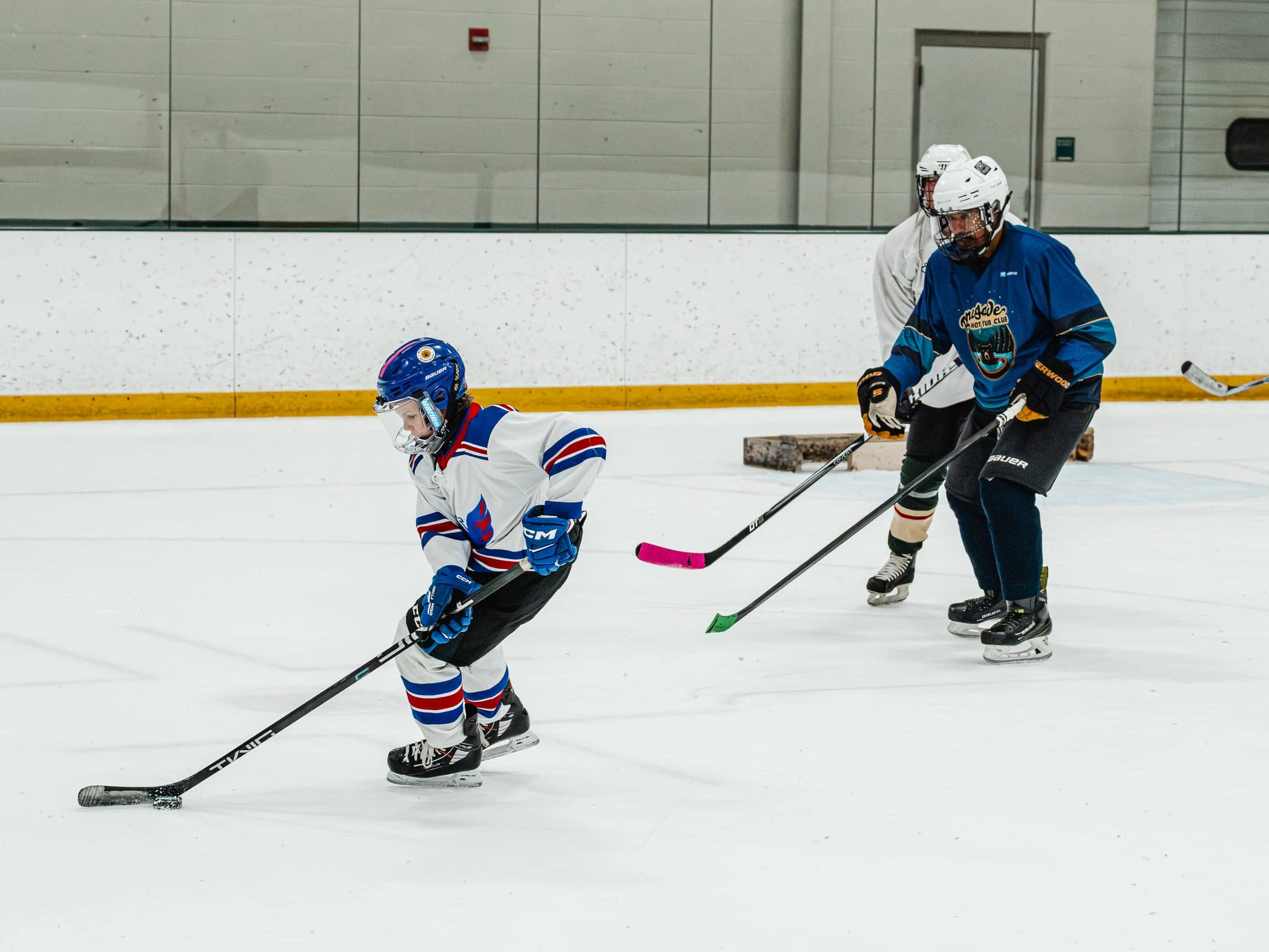 Players on the ice at the Maine Chill Pride Cup