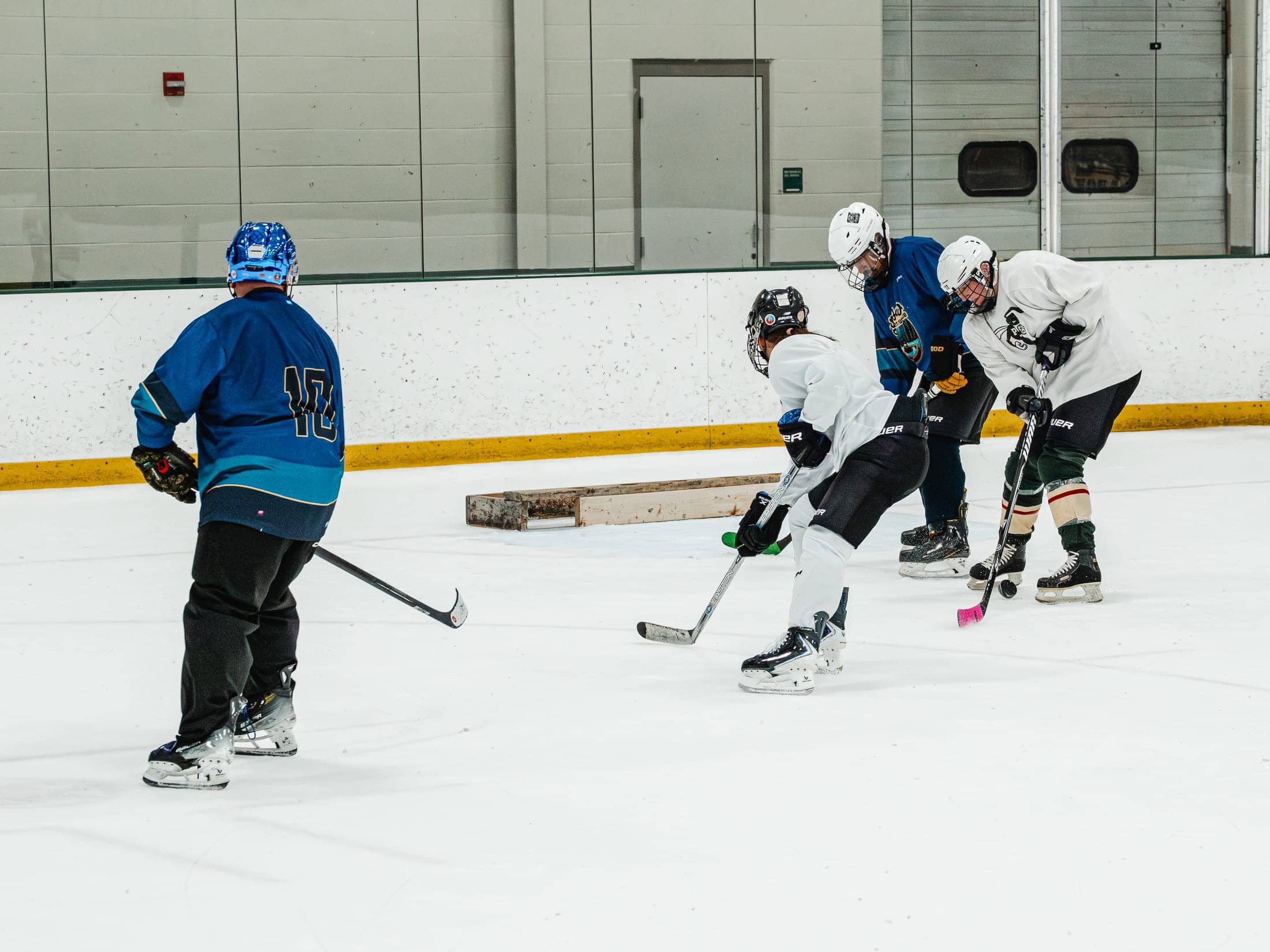 Players on the ice at the Maine Chill Pride Cup
