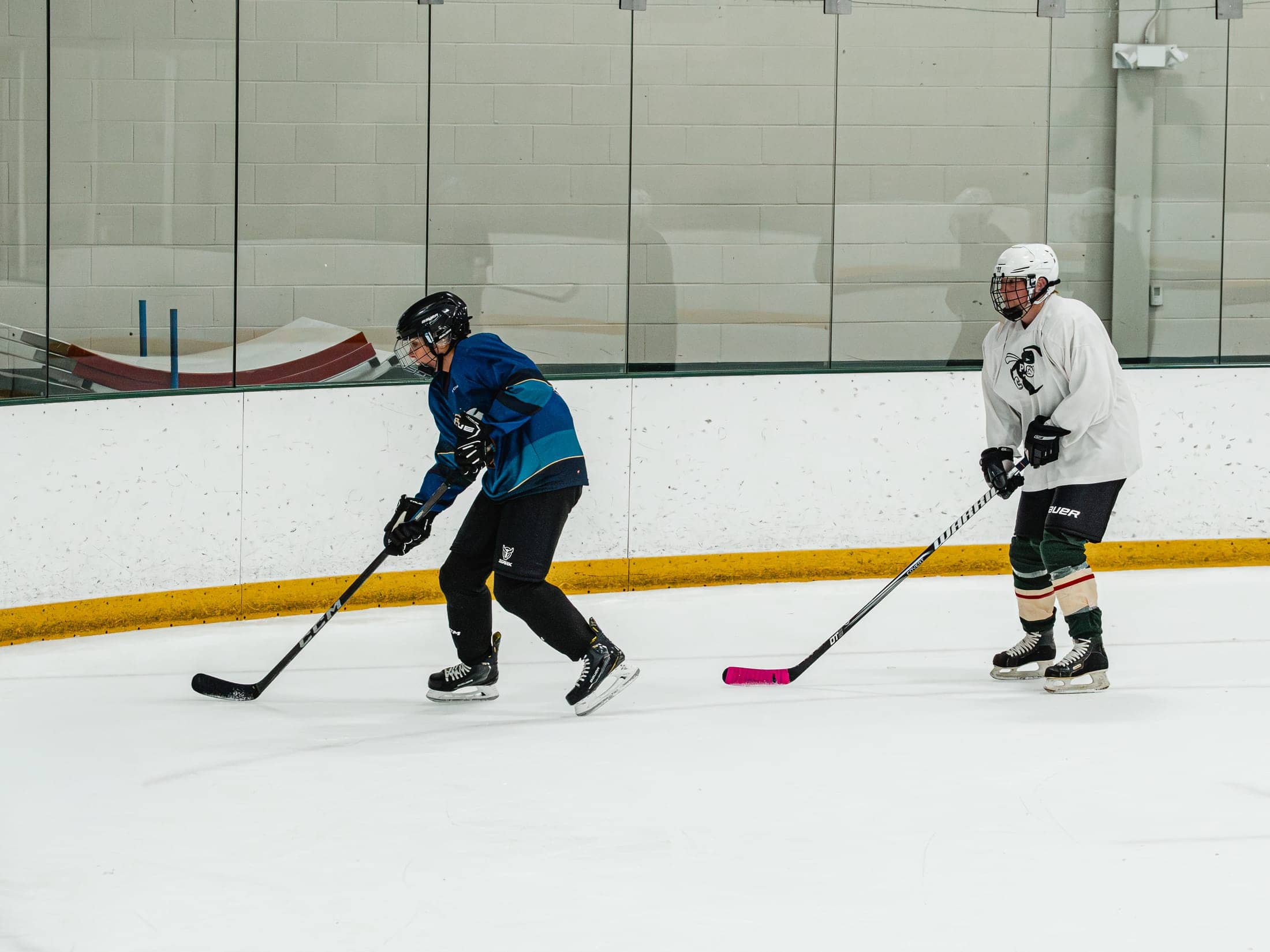 Players on the ice at the Maine Chill Pride Cup