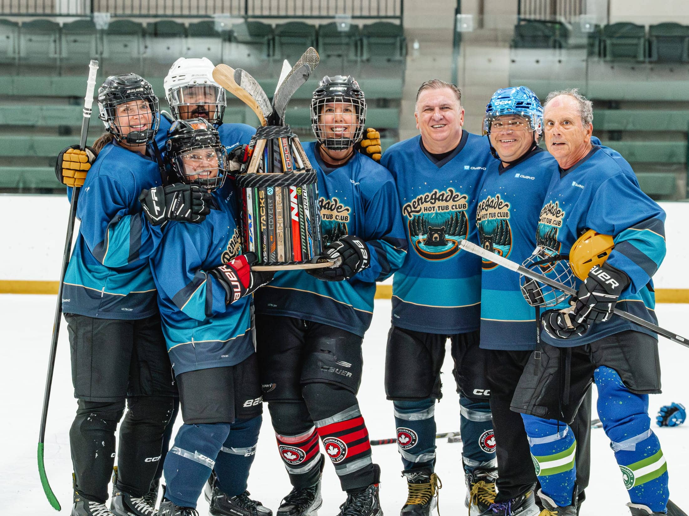 Renegade Hot Tub Club hoisting the trophy as the first Maine Chill Pride Cup champions